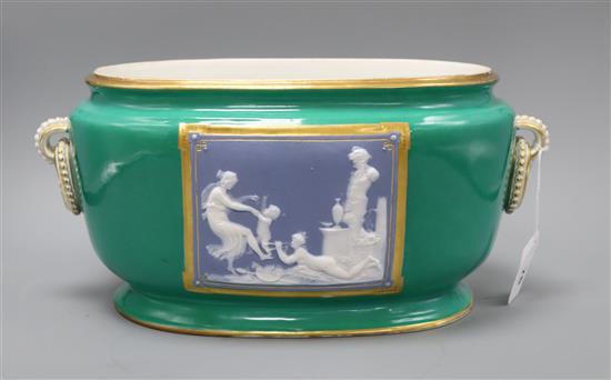 A 19th century green ground oval jardiniere with jasperware plaques of classical scenes, length 39cm